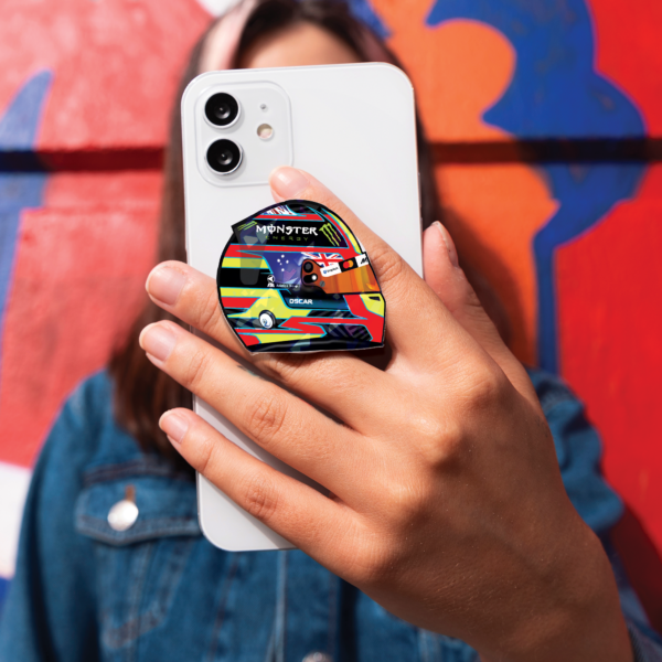 oscar 1 Oscar Piastri helmet-shaped phone grip for smartphones, McLaren Formula 1 inspired accessory in a sleek and functional design.