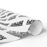 Rolled (3) Free Ferrari F1 gift wrap design featuring Charles Leclerc and Lewis Hamilton