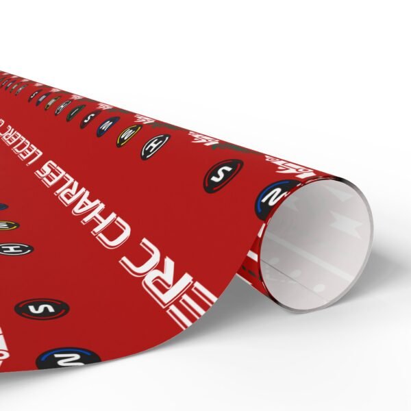 Rolled (6) Free Ugly Sweater Ferrari F1 gift wrap design featuring Charles Leclerc and Lewis Hamilton