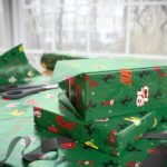 f13 Free Ferrari F1 gift wrap design featuring Charles Leclerc and Lewis Hamilton
