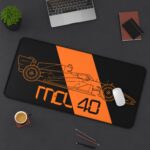 Stealth black MCL40 2026 F1 car blueprint desk mat with papaya orange lines