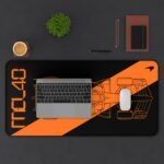 Context 1 (14) Stealth black MCL40 2026 F1 car blueprint desk mat with papaya orange lines