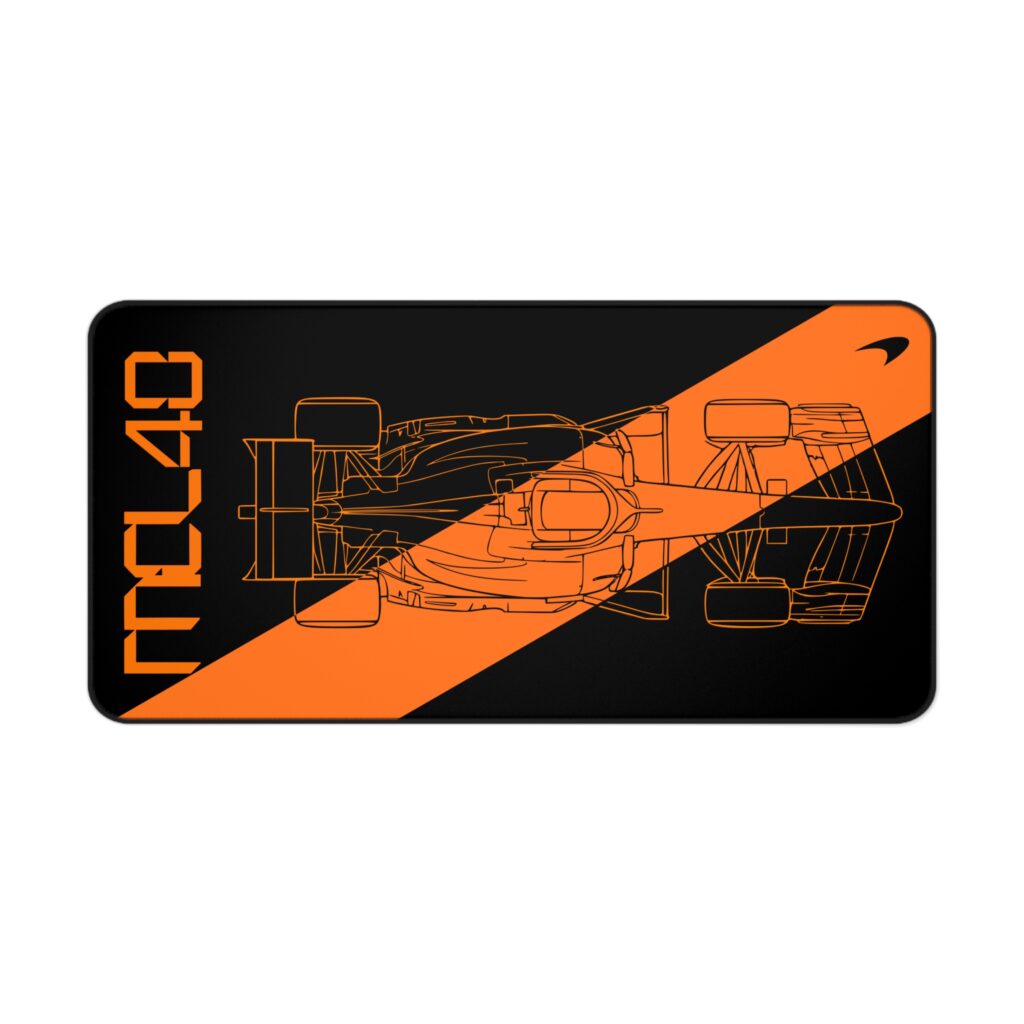 Stealth black MCL40 2026 F1 car blueprint desk mat with papaya orange lines