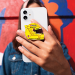 Mockup-Custom Shape Acrylic Phone Grip-Recovered-Recovered Lewis Hamilton's yellow helmet-shaped F1 phone grip held on the back of a phone