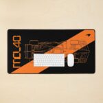 Stealth black MCL40 2026 F1 car blueprint desk mat with papaya orange lines